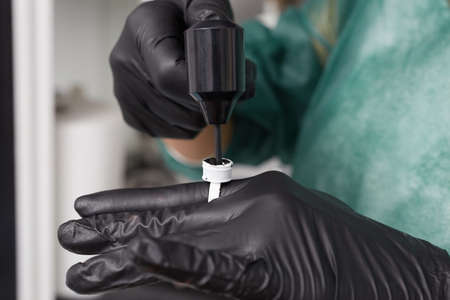 professional tattooist making permanent make up tricopigmentationの写真素材