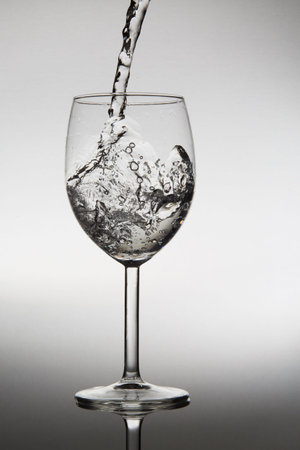 Pouring water into glass