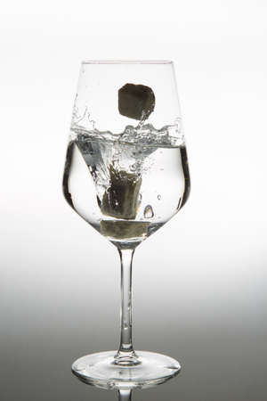 Pouring water into glassの写真素材