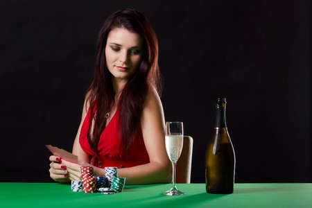 Very beautiful woman playing texas hold'em pokerの写真素材