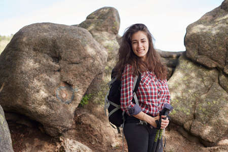 Woman hiking in summer forest in mountainsの写真素材