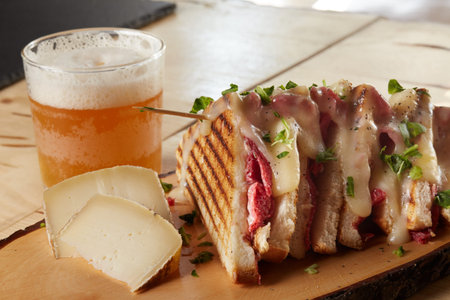 club sandwich with salami and cheese on wooden trayの写真素材