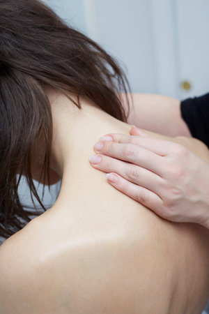 Woman enjoying a wellness back massage in a spa, she is very relaxedの写真素材