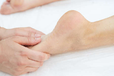Woman Getting a Salt Scrub Beauty Treatment in the Health Spaの写真素材