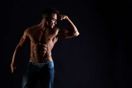 Man with muscular torso. Strong Athletic Man Fitness Model Torso showing six pack absの写真素材