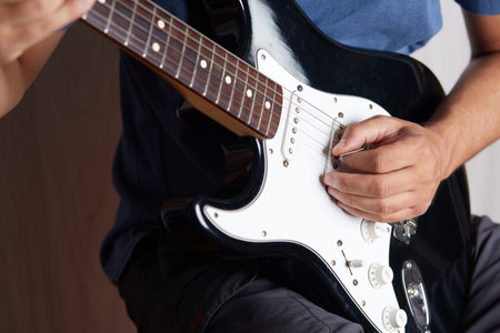 Close up of a lefty electric guitar being played