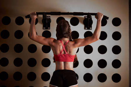 beautiful athletic woman working IN GYMの写真素材