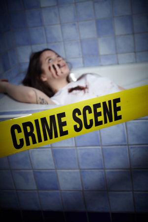 young woman lying dead in a bath tub