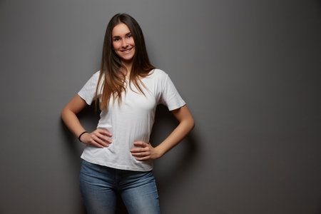 young girl posing in studio background