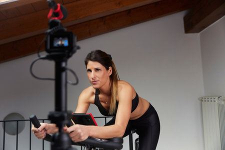 Vlogger recording spinning lessonの写真素材