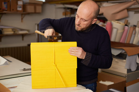 book binder working in a warehouse