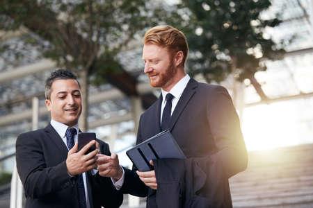 business people working outside office buildingの写真素材