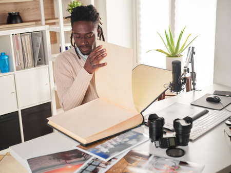 Graphic designer / photographer working in home officeの写真素材