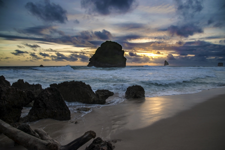 Goa Cina beach at dusk, Malang, East java, Indonesiaの写真素材