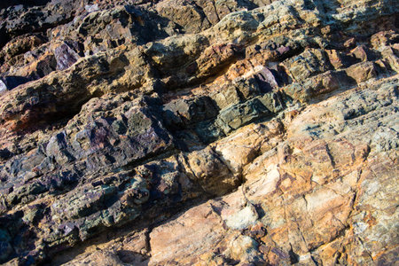 The texture of the rock at the edge of the sea