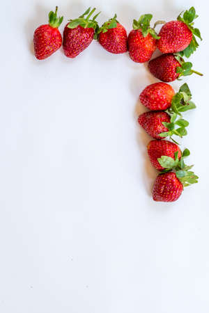 Strawberry frame on a white background. Berry background. Free space.の写真素材