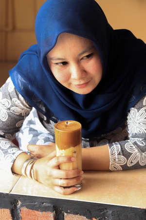 Indonesia - May 24 2020 : the trend of young people today is making dalgona coffeeのeditorial素材