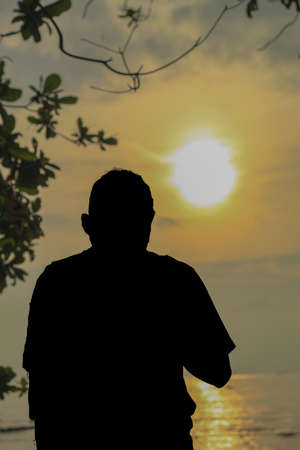 silhouette of a man in the golden bridge, Indonesiaのeditorial素材