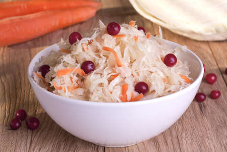 Sauerkraut and ingredients on the kitchen tableの写真素材