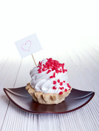 cake with a sign for text on white background