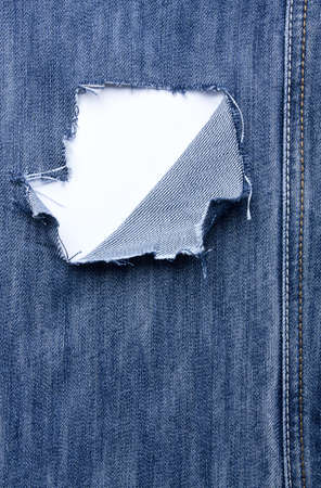 Jeans with holes and seams and a place for textの写真素材