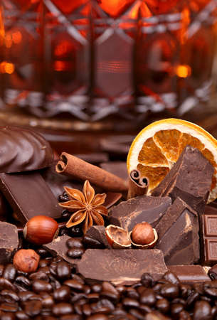 Mixture of pieces of chocolate spices and nuts close-up, selective focusの写真素材