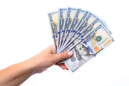 Hand holding a new hundred dollar bills U S  folded like a fan, released into the circulation in October 2013 の写真素材