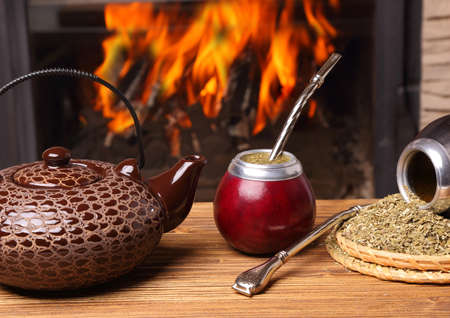 Mate in the calabash, kettle, yerba on fire backgroundの写真素材