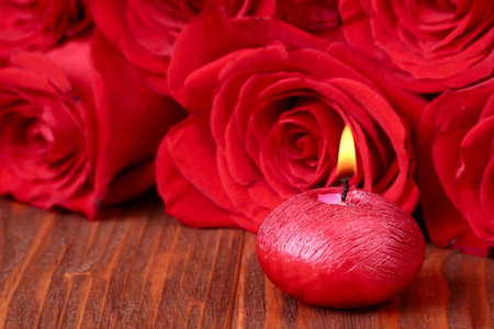 Romantic composition with red candles and roses. selective focusの写真素材