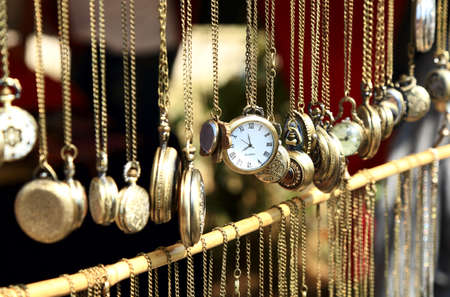 Old antique pocket watch exposed for sale on the market, selective focusの写真素材