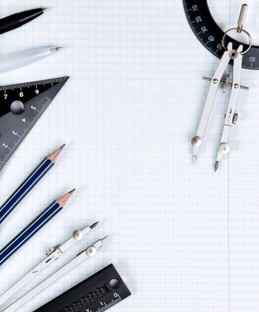 Background - drawing tools on white notebook sheet in the box