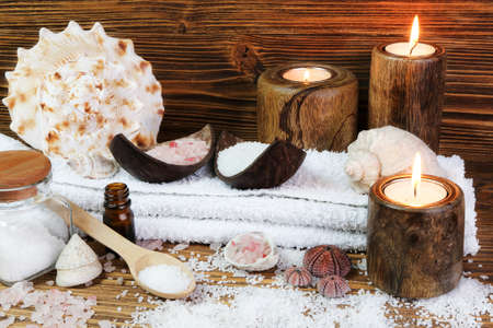 Concept spa with sea saltl and candles on the wooden backgroundの写真素材
