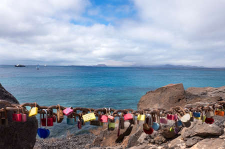 Multicolored castles left by tourists near the seaの写真素材