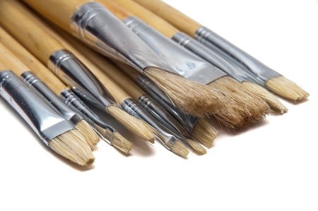 Group of brushes of different thicknesses and new white backgroundの写真素材