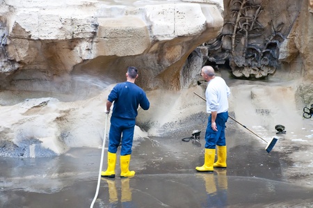 ROME, ITALY-  October 20:two unidentified workers cleaning the Trevi Fountain after the flood on October 20, 2011 in Rome, Italyのeditorial素材