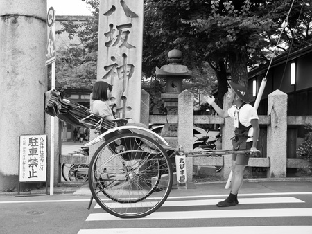 KYOTO, JAPAN, JULY 16: jinrikisha driven by an unidentified driver carrying two Japanese tourists のeditorial素材
