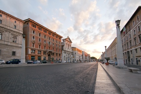 Sunrise on a street without people in the city of Rome, Italyの写真素材