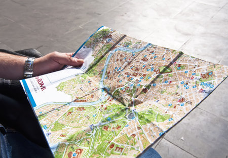 Tourist looking at a map of Rome