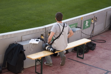Photojournalist during a football matchの写真素材