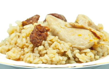 Rice cooked with sausage and chicken on white backgroundの写真素材