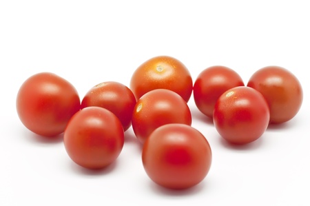 Several cherry tomatoes on white backgroundの写真素材