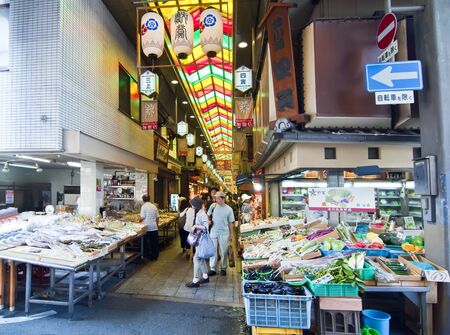 KYOTO, JAPAN, JULY 17: Unidentified tourists in famous Nishiki Ichiba market on July 17,2011 in Kyoto, Japan. The market has a history of Several Centuries, the first shop opening around 1310.のeditorial素材