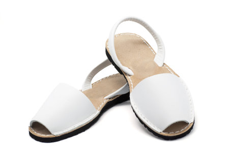 A pair of white sandals over white backgroundの写真素材