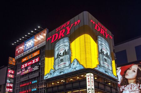 OSAKA, JAPAN- JULY 15: Night view of the famous neon advertisements Dotonbori on July 15, 2011 in Osaka, Japan.  Dotonbori is famous for its historic theatres ,its shops and restaurants, and its many neon and mechanised signsのeditorial素材