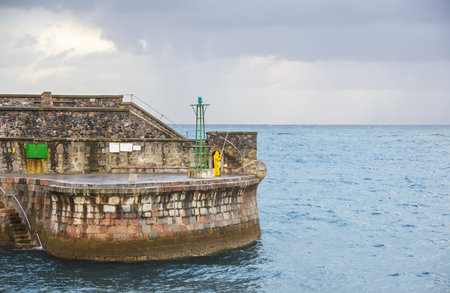 Fisherman fishing on port Elantxobe in Vizcaya