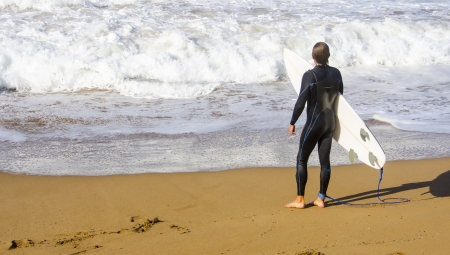  Surfer waiting in the sand at the beach surfing Zarautzの写真素材