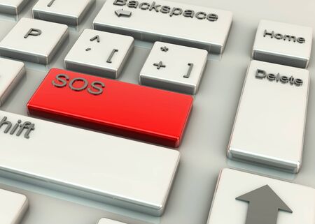 Computer keys with the word SOS on a red highlighting keyの写真素材