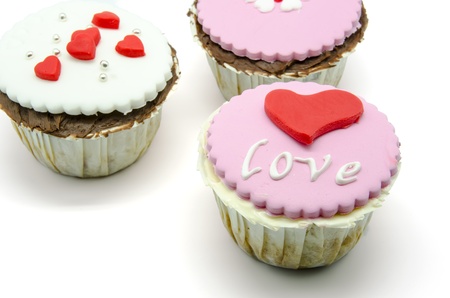 Gourmet cupcakes with hearts and decorationsの写真素材