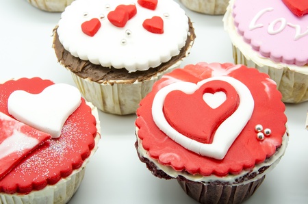 Gourmet cupcakes with hearts and decorationsの写真素材