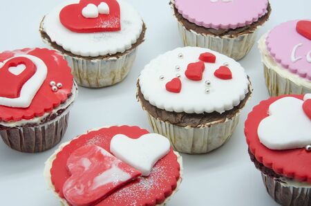 Gourmet cupcakes with hearts and decorationsの写真素材